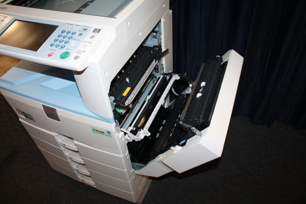 A printer that has been opened up and is ready to print.