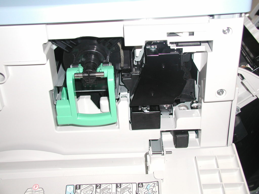 A close up of the inside of an open printer